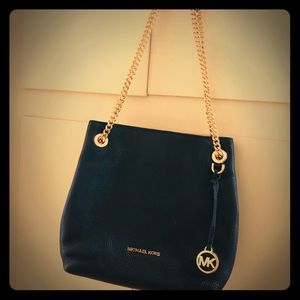 Michael Kors black medieum size purse.